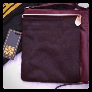 Pour la Victoire oxblood horsehair crossbody bag.
